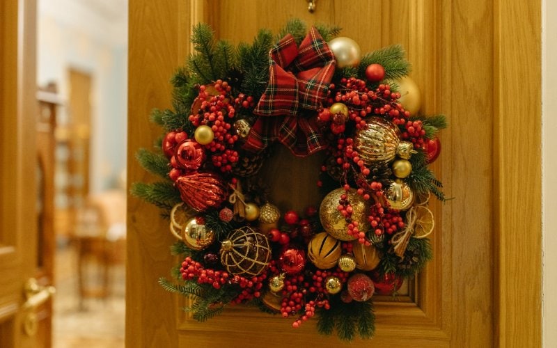 a Christmas wreath hanging on the door