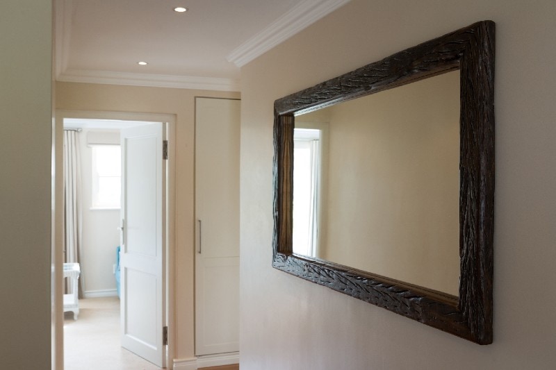 a large mirror hanging on the wall