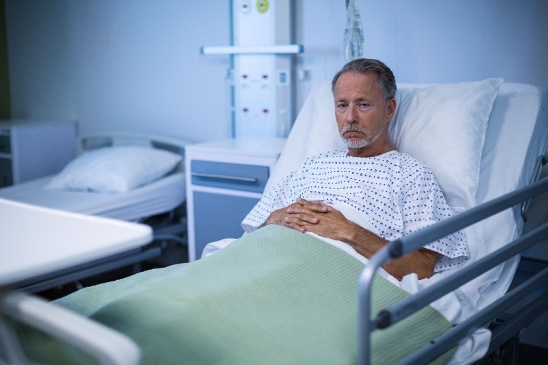 a patient lying on hospital bed