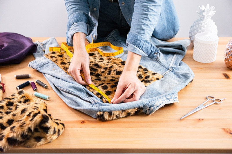 a woman upcycling her clothes