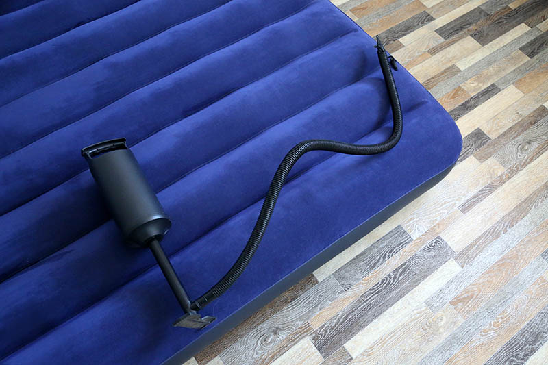 air mattress and pump on the floor