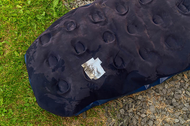 air mattress repaired using duct tape