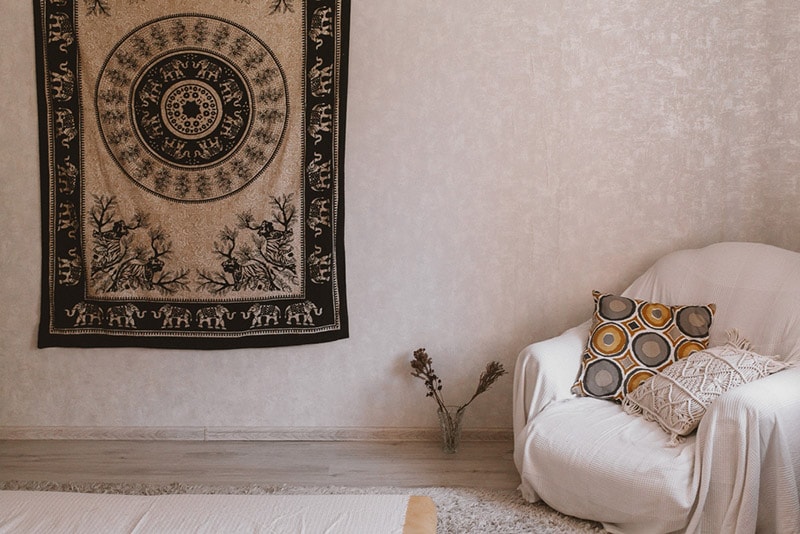 an ornamental rug hanging on a wall