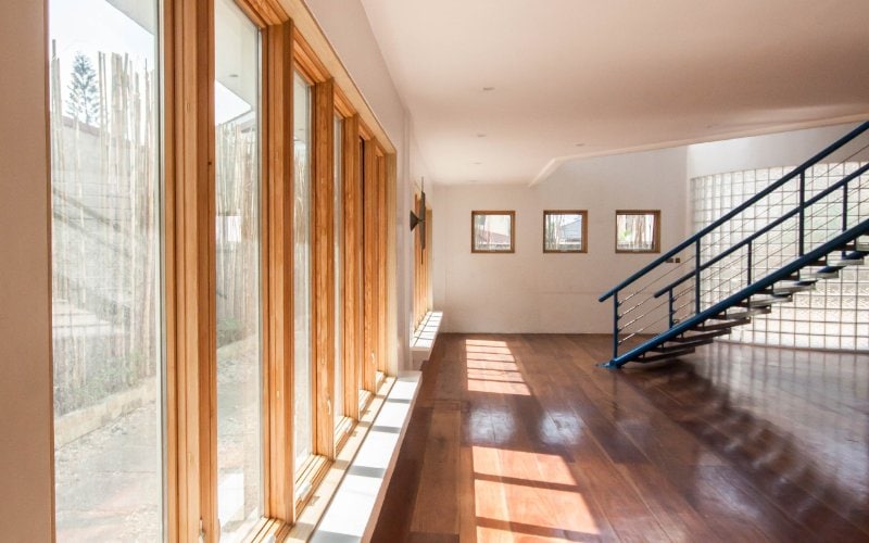 big windows with brown wooden frames