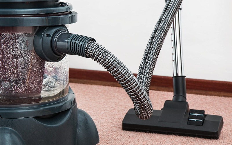 black and red canister vacuum