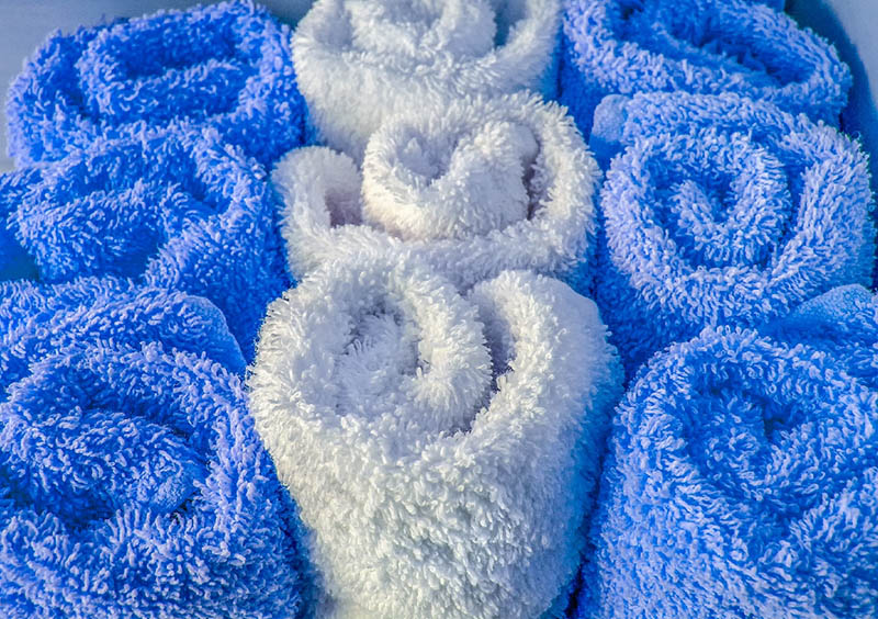 blue and white rolled towel