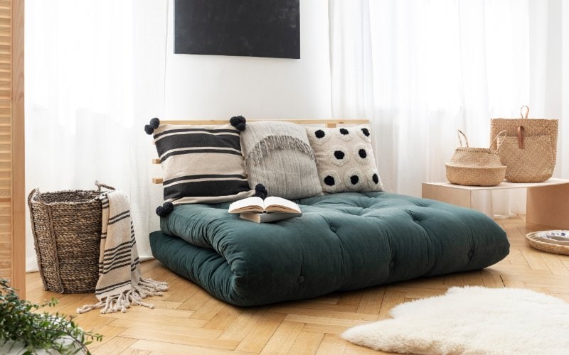 green futon on the floor