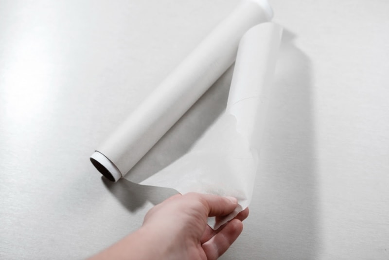 hand holding waxed paper