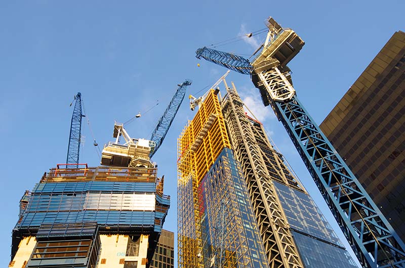 low view of the cranes to build new skyscrapers in the City of London