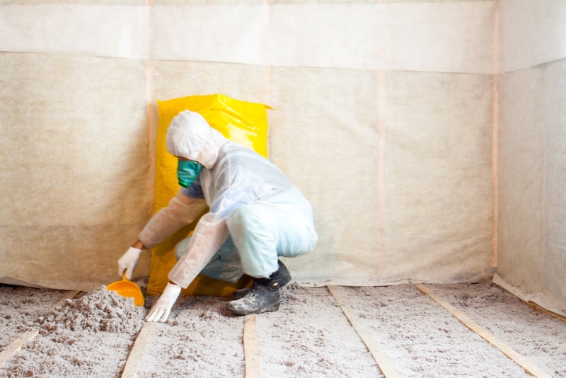 man making cellulose insulation