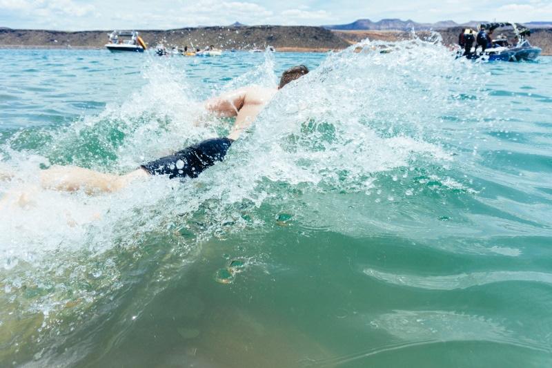 man swimming in the sea