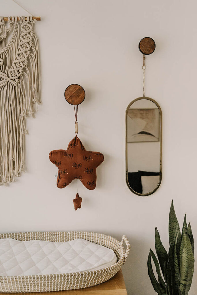 mirror hanging in the nursery room