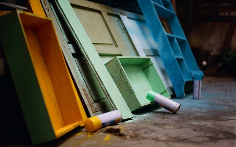 old drawers and shelves being repainted to be reused