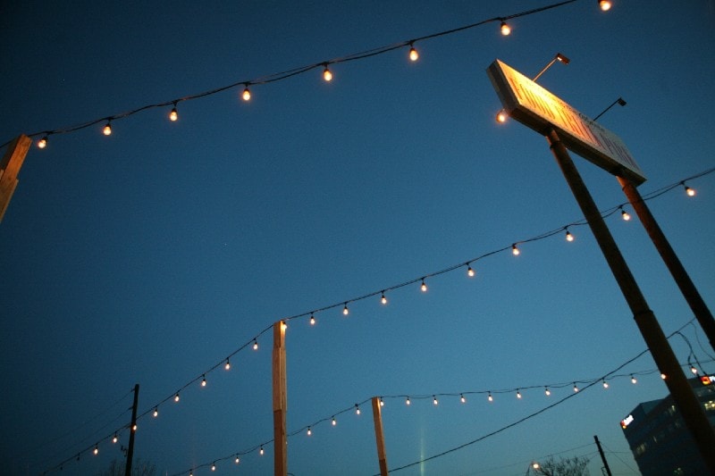 outdoor string lights on wooden posts