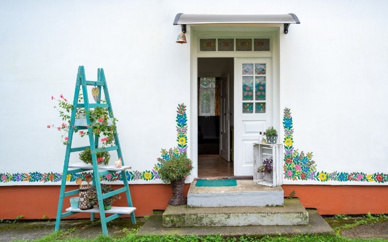 plants on upcycled ladder outside the house