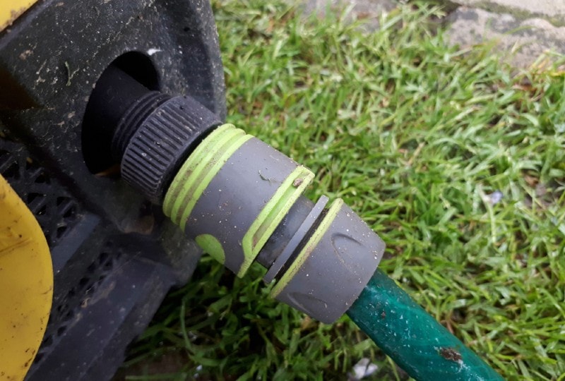 plastic hose connector connected to pressure washer