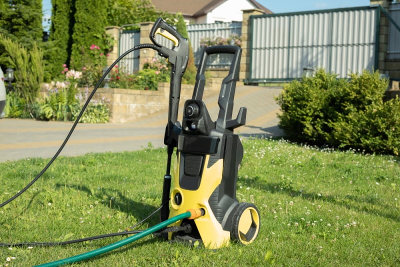 pressure washer in the grass