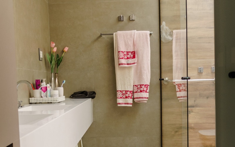towels hanging on the wall of a bathroom