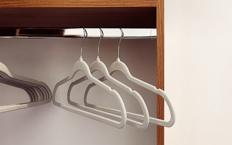 white velvet hangers in the closet