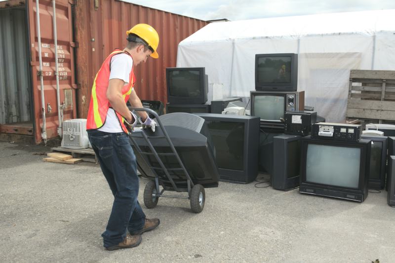 worker who recycling tv on recycle center
