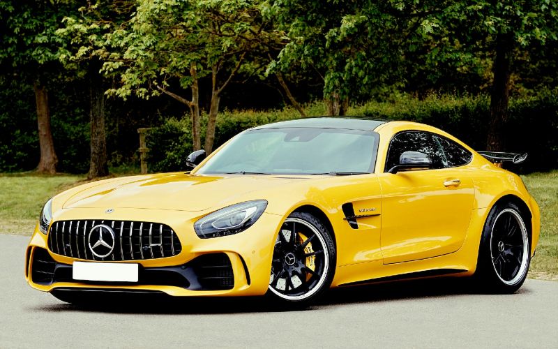 yellow Mercedes Benz AMG GT