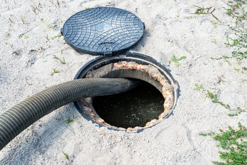A four-inch suction pipe inserted into a home septic tank