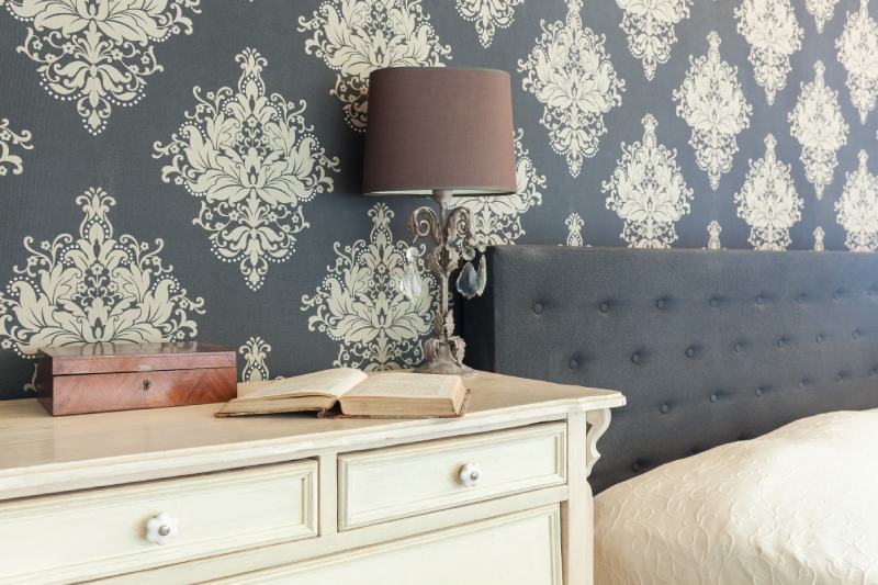 Close-up of patterned wallpaper in retro bedroom interior