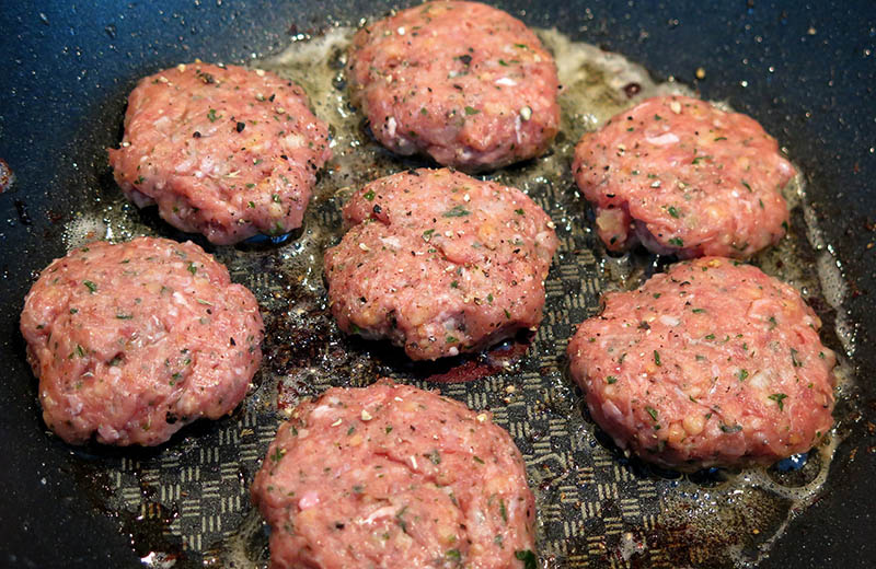 Cooking burger patties with fat oil