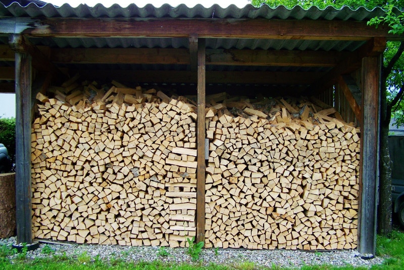 Firewood stored in a large wood shed