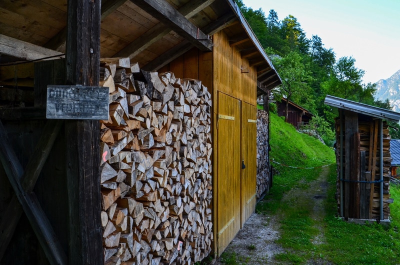 Firewood stored in multiple sheds