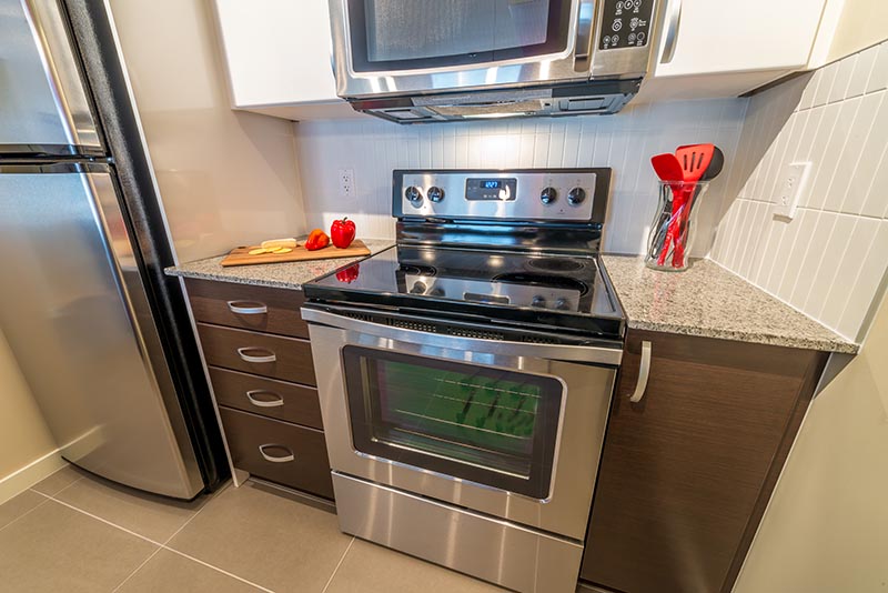 Fragment of the nicely decorated small luxury kitchen with modern appliances