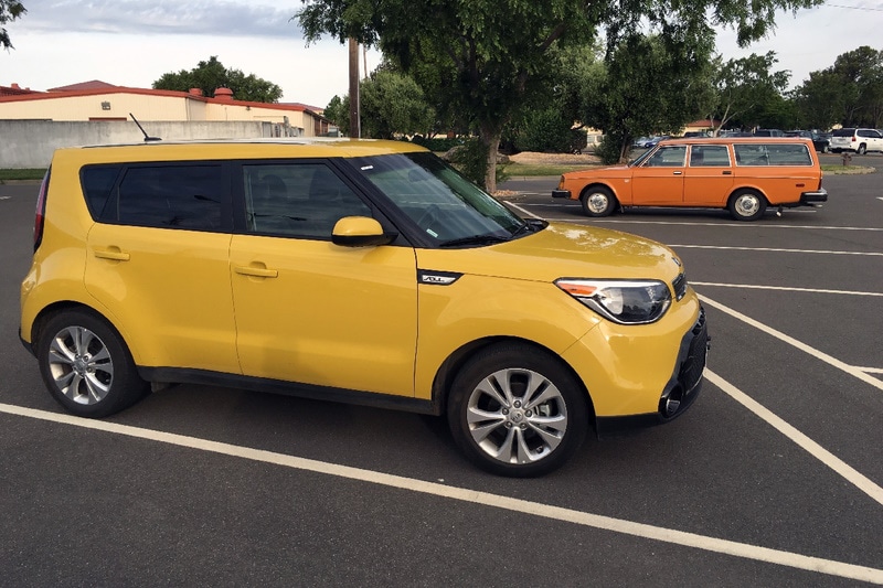 Gold Kia Soul in the parking lot