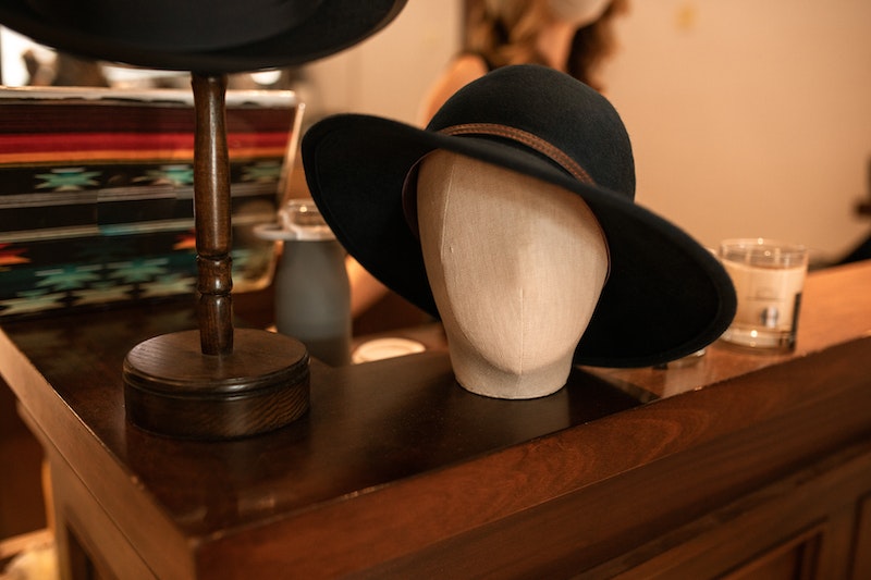 Hat on a mannequin's head on the table