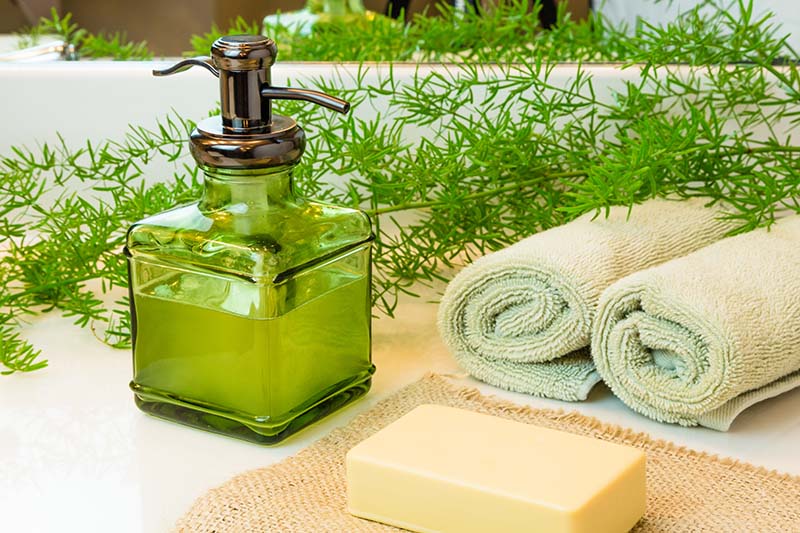Pump green glass bottle with liquid castile soap