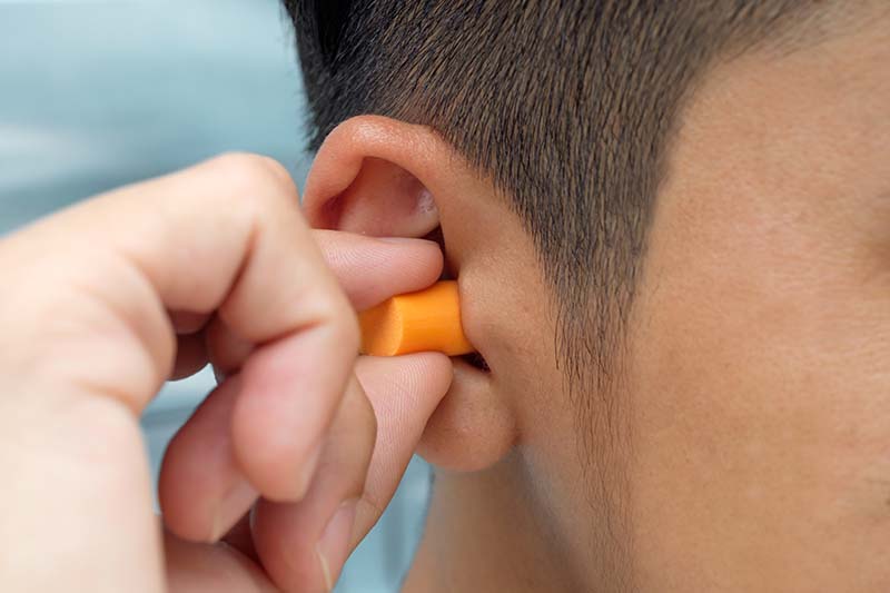 Put protective earplug into the ear