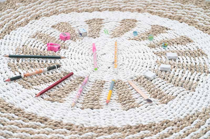 Stationery scattered on the seagrass rug