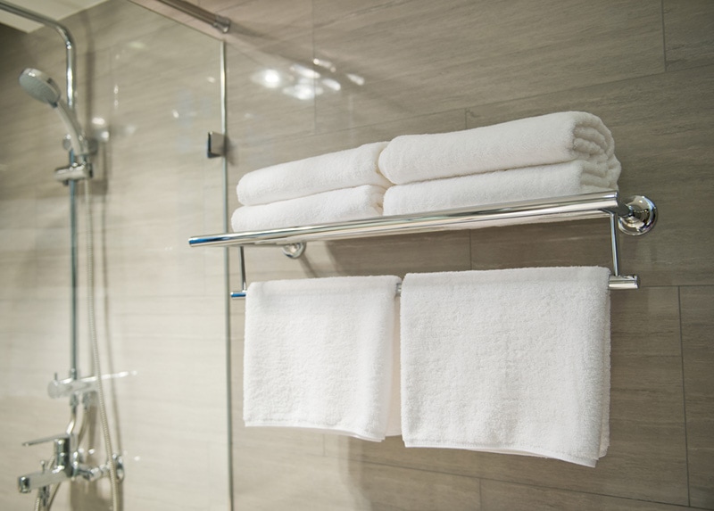 clean white towels on a bathroom hanger