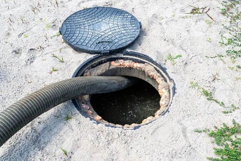 four inch suction pipe siphoning waste out of a full home septic tank