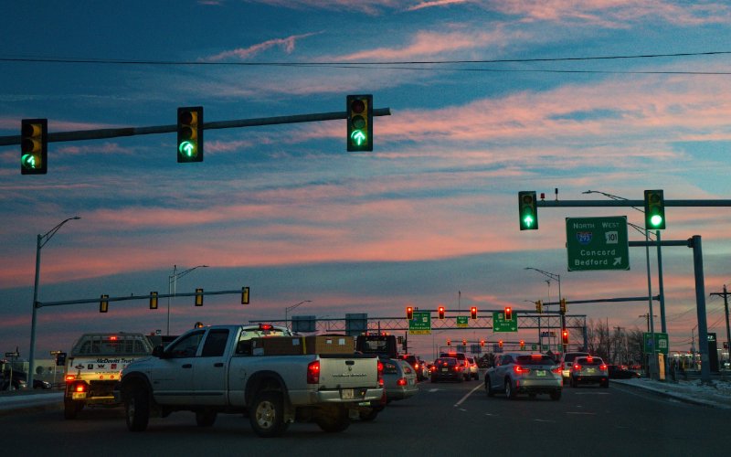 heavy traffic on a road with traffic lights