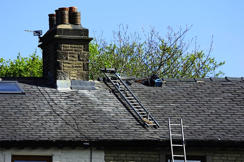 ladder hooked on a sloped roof