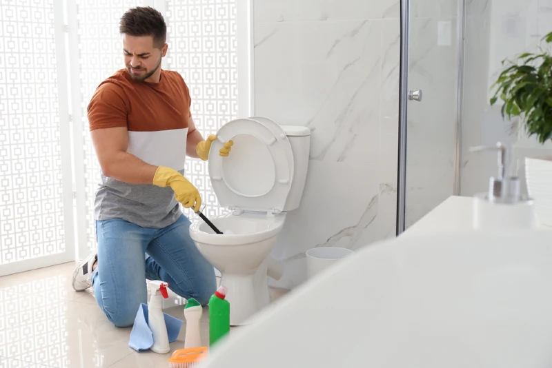 man disgusted with smelly toilet bathroom
