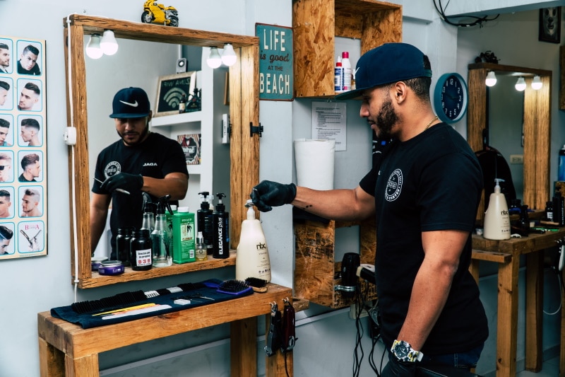 man facing the mirror in barber shop