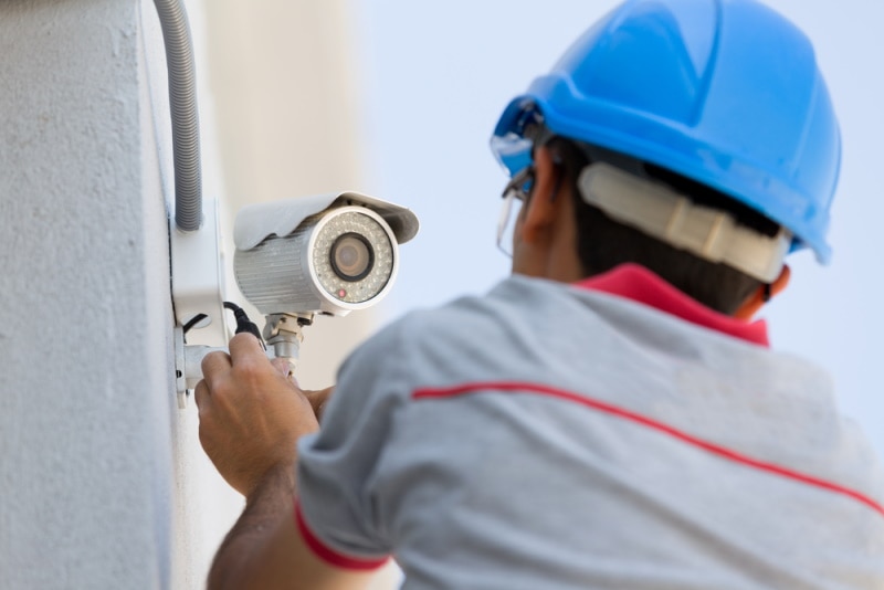 man installing cctv camera