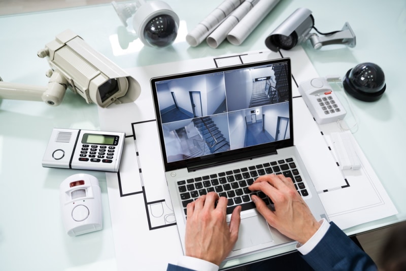 man monitoring security camera