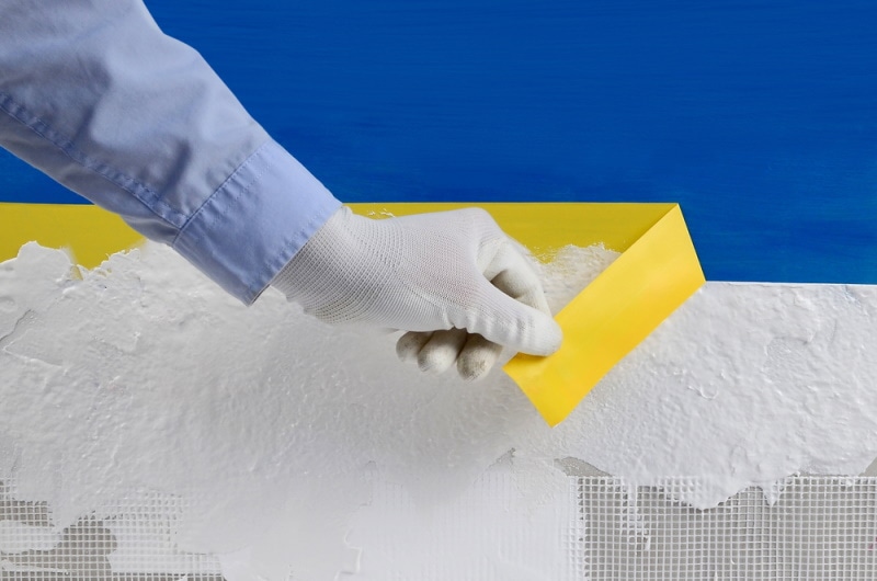 man removing adhesive tape