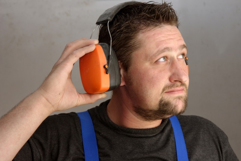 man using ear muffs