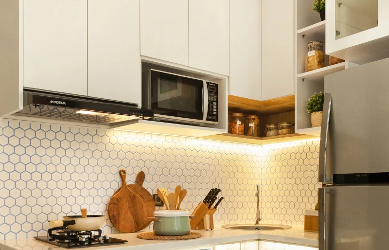 microwave in an open cabinet space in the kitchen