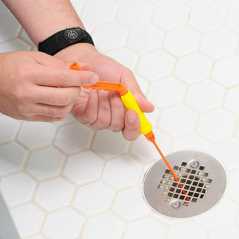person using FlexiSnake Drain Weasel Sink Snake Cleaner