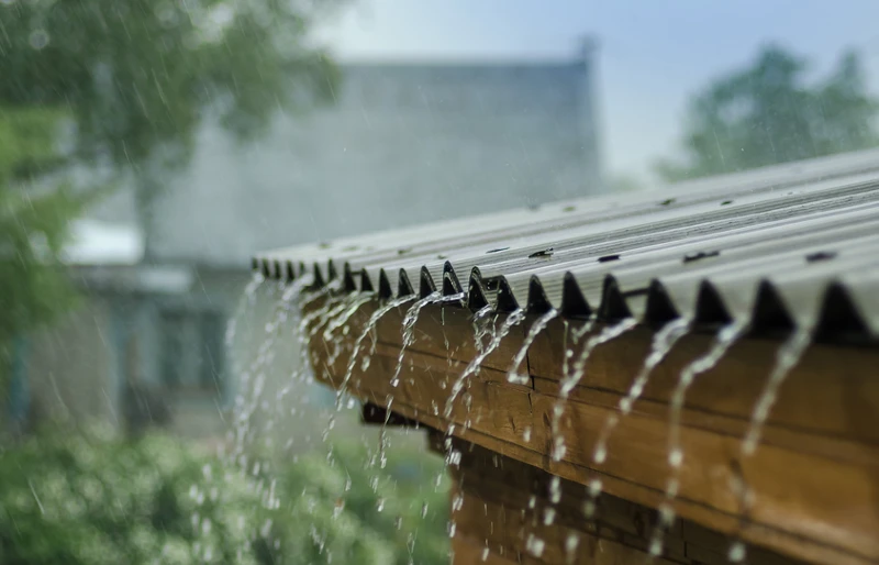 rain water pouring down from the roof