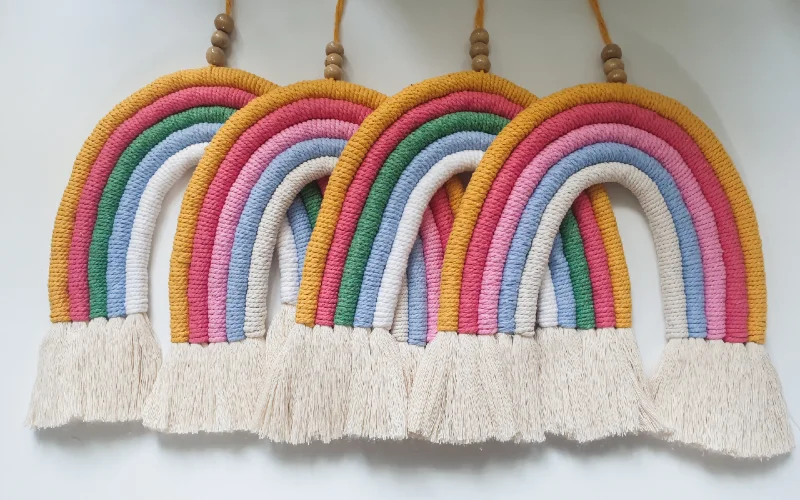 rainbow wall decoration made of yarn